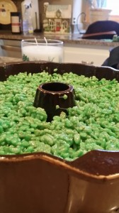 Rice Krispie mixture lightly pressed into Bundt pan | https://juliesaffrin.com
