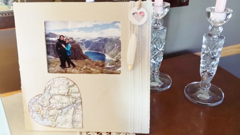 buffet table picture of their engagement with map of Norway and feather for web
