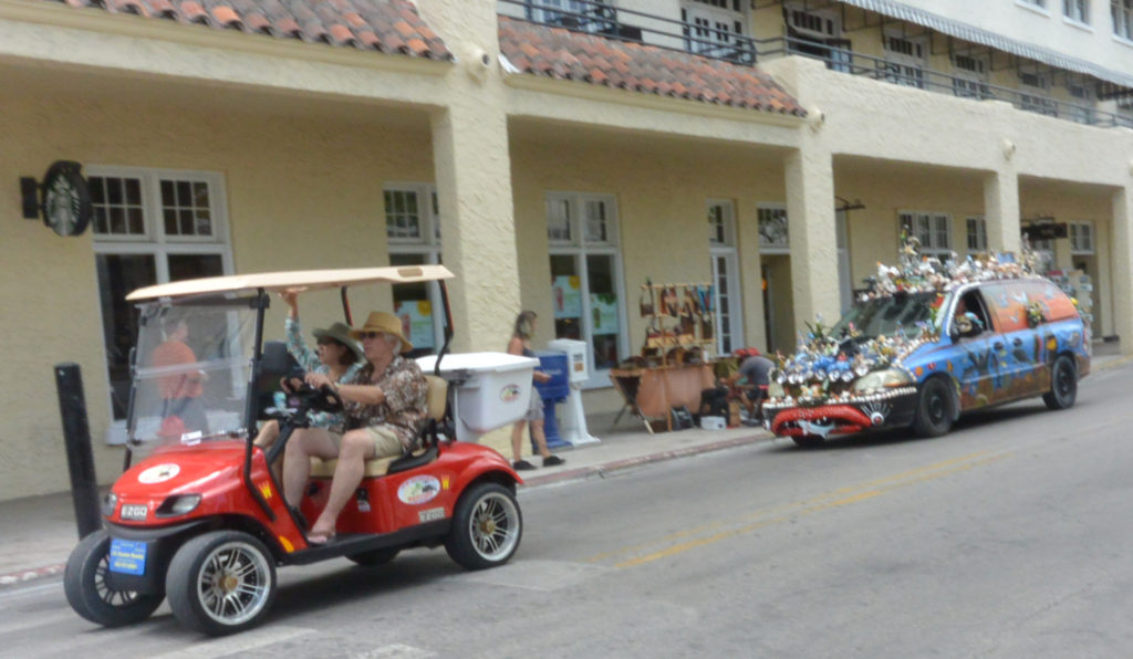 Classic Key West. Tourists and a hippie peace car
