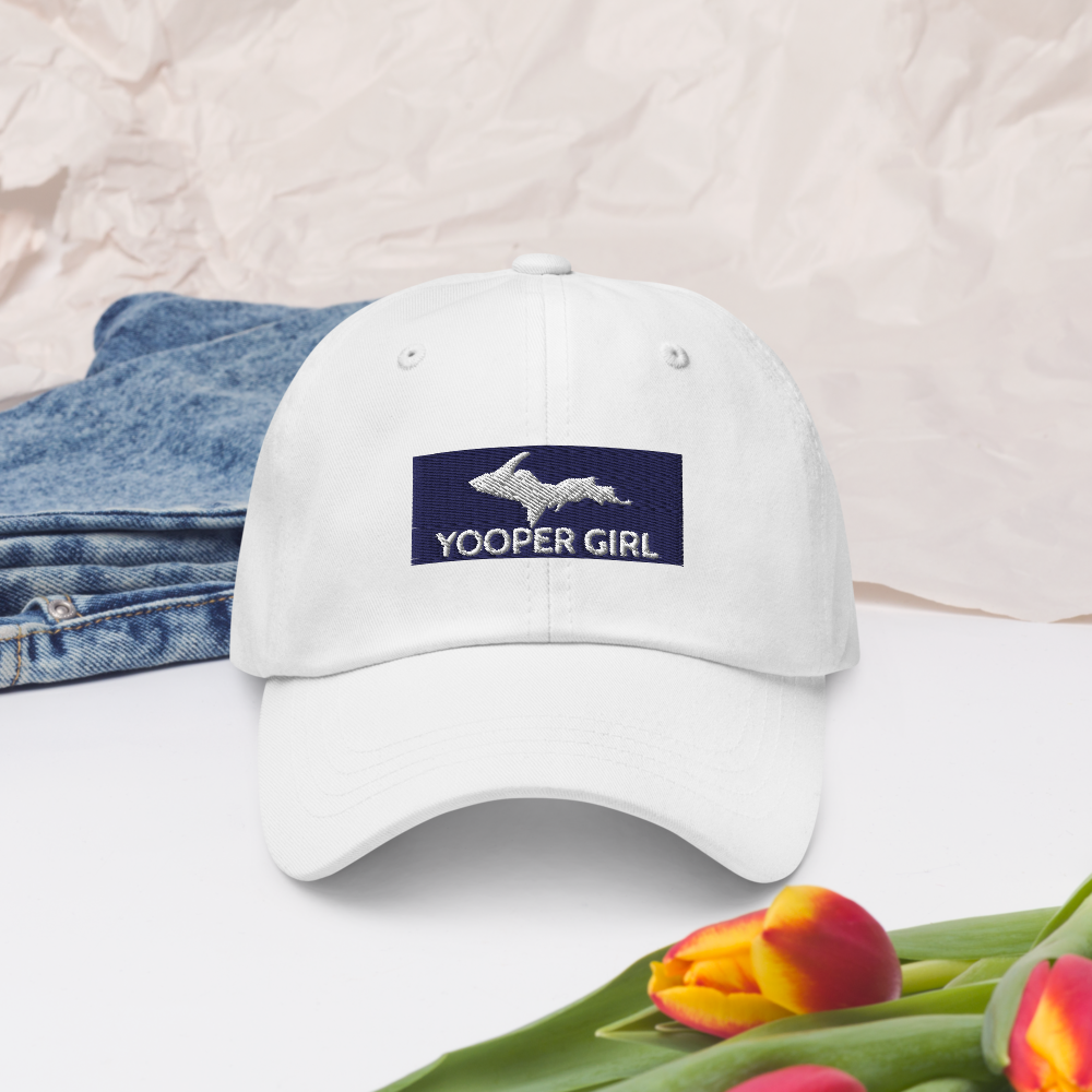 Yooper Girl White Hat with jeans and flowers backdrop