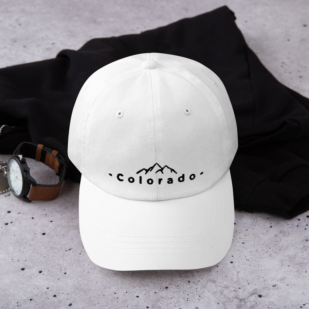 Colorado White Hat with Black Letters and Rockie Mountains